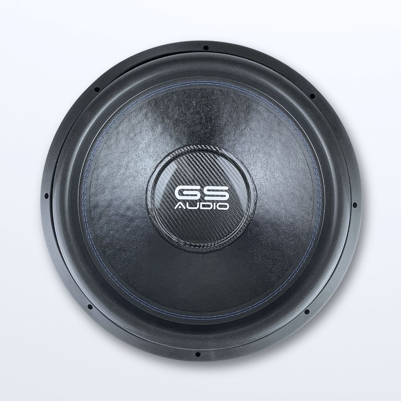 Una vista desde arriba del subwoofer de 18 pulgadas «GS Audio Platinum 4000 MK3» muestra su superficie negra, la parte central texturizada y las costuras visibles sobre un fondo claro.
