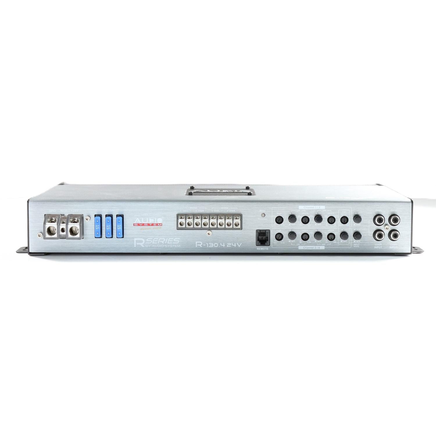 The Audio System R-130.4 24V is a silver 4-channel car audio amplifier with multiple input/output ports, control knobs, and labeled connectors on a white background.