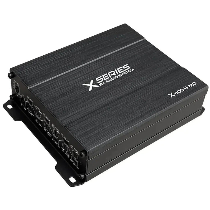 A black rectangular Audio System X-100.4 MD digitaler Hochleistungs-Verstärker with multiple input and control ports on one side.