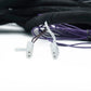 Due connettori Audison Prima AP TSL 3YB 01 bianchi con fili viola, raffigurati su una superficie bianca: perfetti per la Tesla Model 3 e gli accessori per amplificatori.