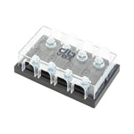 El dBvox DBVOXMFM4 es un portafusibles transparente con cuatro puntos de conexión, colocado sobre una base rectangular negra y rematado con una tapa de plástico transparente.