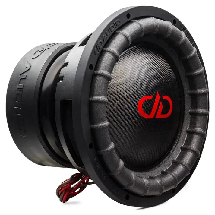 Close-up of a DD Audio Power Tuned 9515k ESP subwoofer with textured cone, red logo, grooved edges, and red/black wiring; delivers powerful 2000W RMS sound.