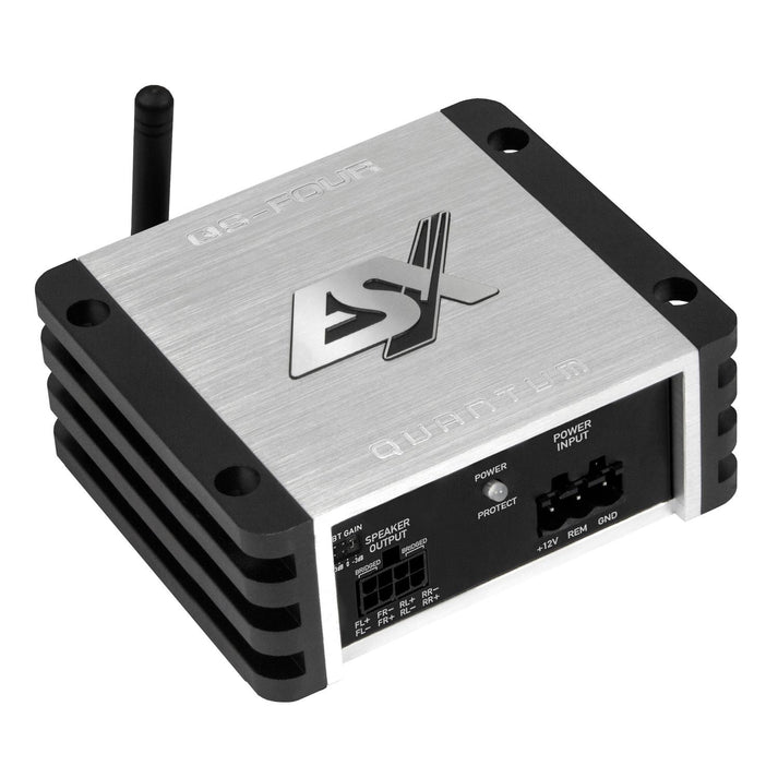 The ESX QS-FOUR-BT is a compact silver 4-channel DSP amplifier with black side fins, one antenna, and multiple front input/output ports.