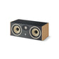 Il Focal ARIA EVO X CENTER è un diffusore centrale rettangolare con frontale nero, due woofer rotondi, un tweeter centrale e lati in legno chiaro su sfondo bianco.