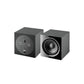 Two black Focal Sub 600 P cube subwoofers: one displays the speaker cone, the other shows the rear 600-watt amplifier and input ports.