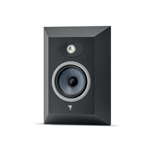 A black, rectangular Focal Theva Surround speaker with beveled edges and two circular drivers smaller above larger, shown against a white background.