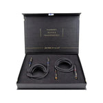 A black box displays two Four Connect Solo 1m 2-Kanal cinch cables with gold connectors; Harmony, Details, Transparency is printed inside the lid.
