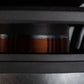 Primo piano di una bobina di rame all’interno di una cornice metallica nera, parte del subwoofer di fascia alta “Aero 10” di Gladen Aerospace.