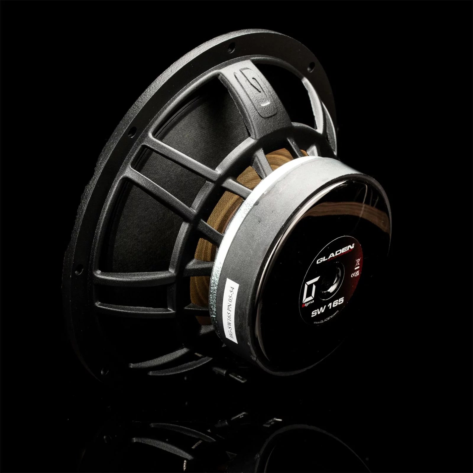 Close-up of a Gladen Sigma 165 6.5 car audio speaker with metal frame, visible wiring, and label on a black background.