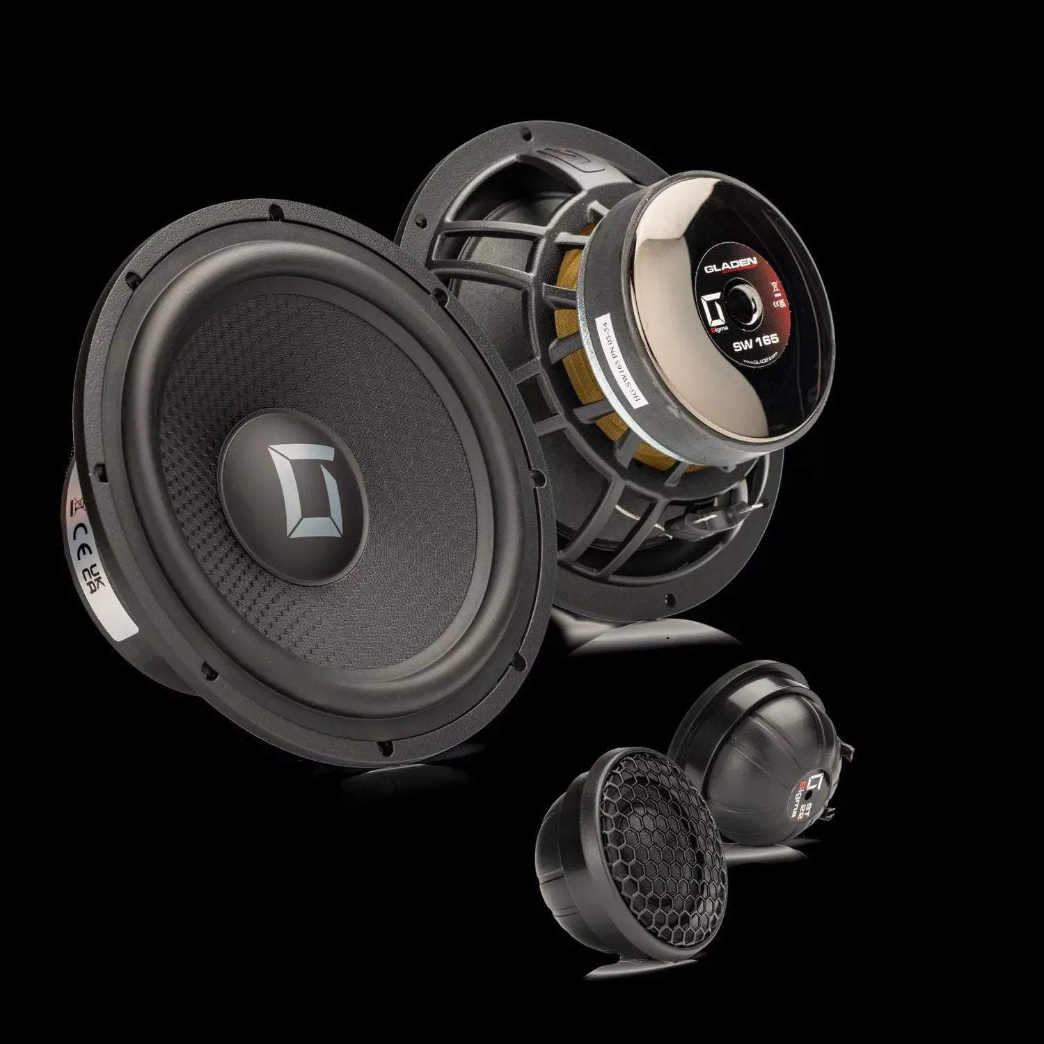 Two large and two small Gladen SIGMA 165.2 AC speakers with a sleek black and metallic design are shown against a black background.