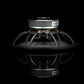A Gladen Sigma 200 speaker driver for Car Audio, black with metal frame and terminals, is side-viewed and reflected on a shiny black surface.