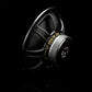 The Gladen Sigma 200 subwoofer, shown with a metallic frame and visible wiring on a black background—ideal for car audio fans.