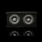 El Gladen Sigma SSW065 Dual, un subwoofer negro con dos altavoces de 6,5 y logotipos Sigma plateados, se presenta sobre un fondo oscuro con un sutil reflejo en la parte inferior.
