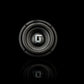 Il Gladen Sigma SSW065, un subwoofer nero con il logo Gladen argentato, offre bassi precisi ed è raffigurato su uno sfondo nero con un leggero riflesso.