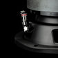 Primo piano del terminale per altoparlanti Gladen Sigma SSW065 nero con morsetto a molla e cavo bianco, perfetto per installazioni in veicoli compatti su sfondo scuro.