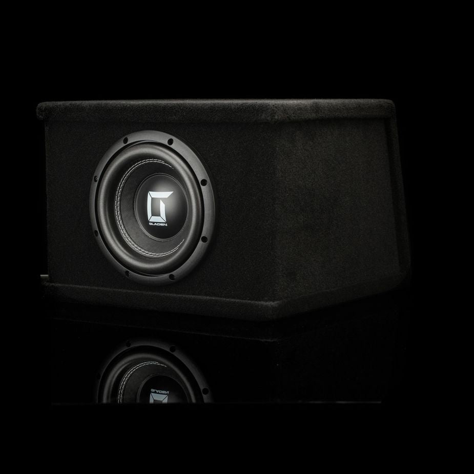 The Gladen Sigma SSW08-VB, an 800 Watt black subwoofer, features a square logo and carpeted enclosure, displayed against a black background.