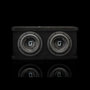 A black rectangular Gladen Sigma SSWX065 Dual subwoofer enclosure with twin 6.5 drivers, mirrored on a glossy surface.