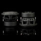 Dos subwoofers Gladen Sigma SSWX08 negros de 8 están colocados uno al lado del otro sobre una superficie negra brillante, lo que resulta ideal para cualquier sistema de audio para coche de alta gama.