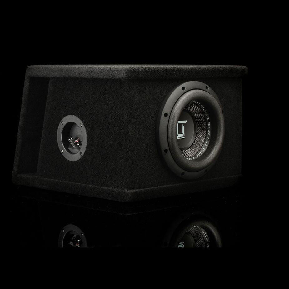 A black Gladen Sigma SSWX08VB 8 subwoofer with round speaker, front port, on a black background with subtle reflection.