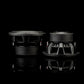 Due subwoofer da 10 pollici del modello Gladen Sigma SSWX10 sono posizionati su una superficie nera lucida: ideali per potenti impianti audio per auto.