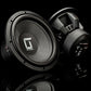 Se muestran dos subwoofers Gladen Sigma SSWx12 sobre un fondo negro: uno destaca el cono de 12, mientras que el otro muestra los detalles de la parte trasera y los laterales.