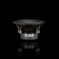Un subwoofer Gladen Zeta 08 nero, con telaio in metallo ed etichetta Zeta 08, è raffigurato su uno sfondo nero, che riflette i suoi bassi potenti.