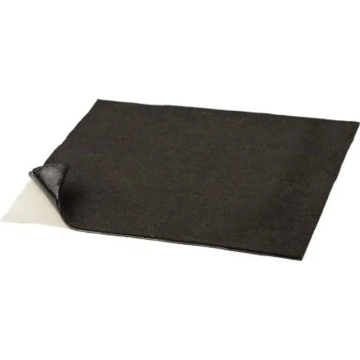 Un foglio nero rettangolare con un angolo staccato, che rivela un lato inferiore più chiaro, simile al tappetino protettivo Ground Zero GZDM 1900MC-GOLD 10x37x50cm.