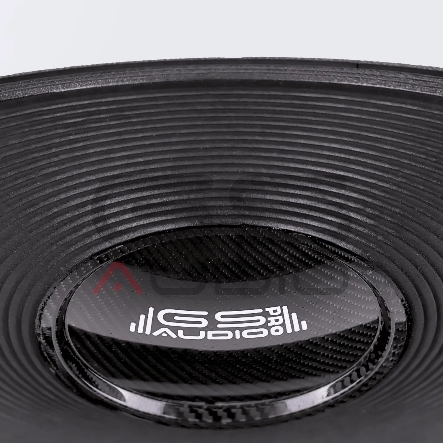 Close-up of GS Audio PRO 18F4-2500W black speaker cone, labeled PRO AUDIO, with Mid-Bass-Transducer tech for high-end PA installations.