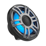 Le Hertz HMX 7.7 S-LD-G.2 est un haut-parleur coaxial rond, de couleur noire et argentée, doté dun anneau LED bleu, dune grille métallique et du logo HERTZ en bas.