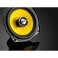 Close-up of a JL Audio C1-525X 5-inch yellow and black speaker on a glossy black surface reflecting the speaker.