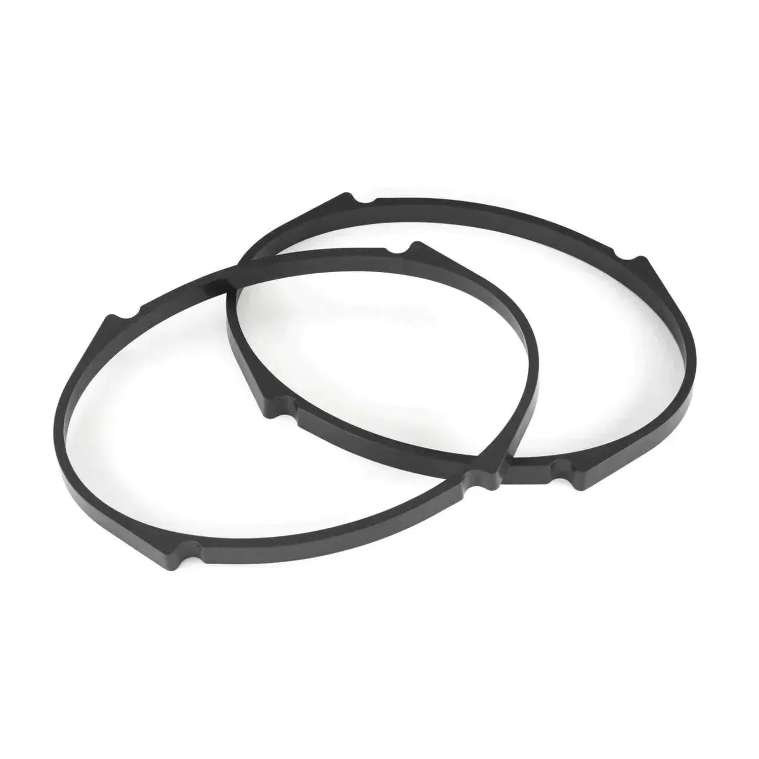 Two black, round rubber gaskets for JL Audio C1-570X 5x7 speakers overlap on a white background; both have notched edges.