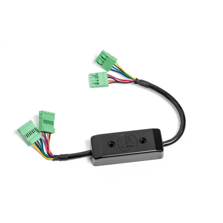 The JL Audio FIX-LSA-4 is a black OEM-Audiointegration adapter with a rectangular casing and three green multi-wire connectors.