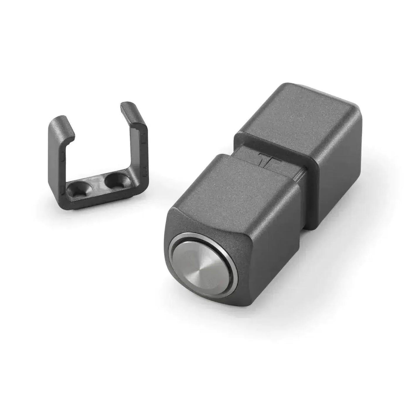 A JL Audio VXI-BTC black rectangular switch with a silver circular button is shown beside a small black mounting clip.