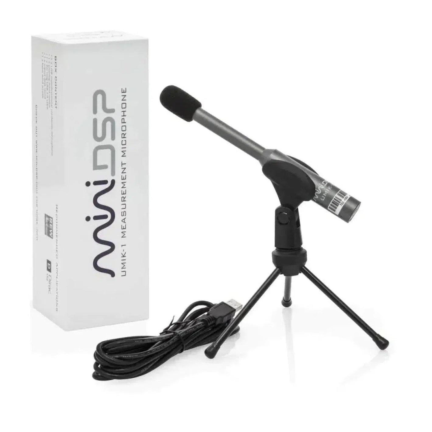 Un microphone de mesure miniDSP UMIK-1 V3, monté sur un petit trépied et muni dun câble USB, est posé à côté dune boîte blanche portant linscription « miniDSP UMIK-1 V3 ».