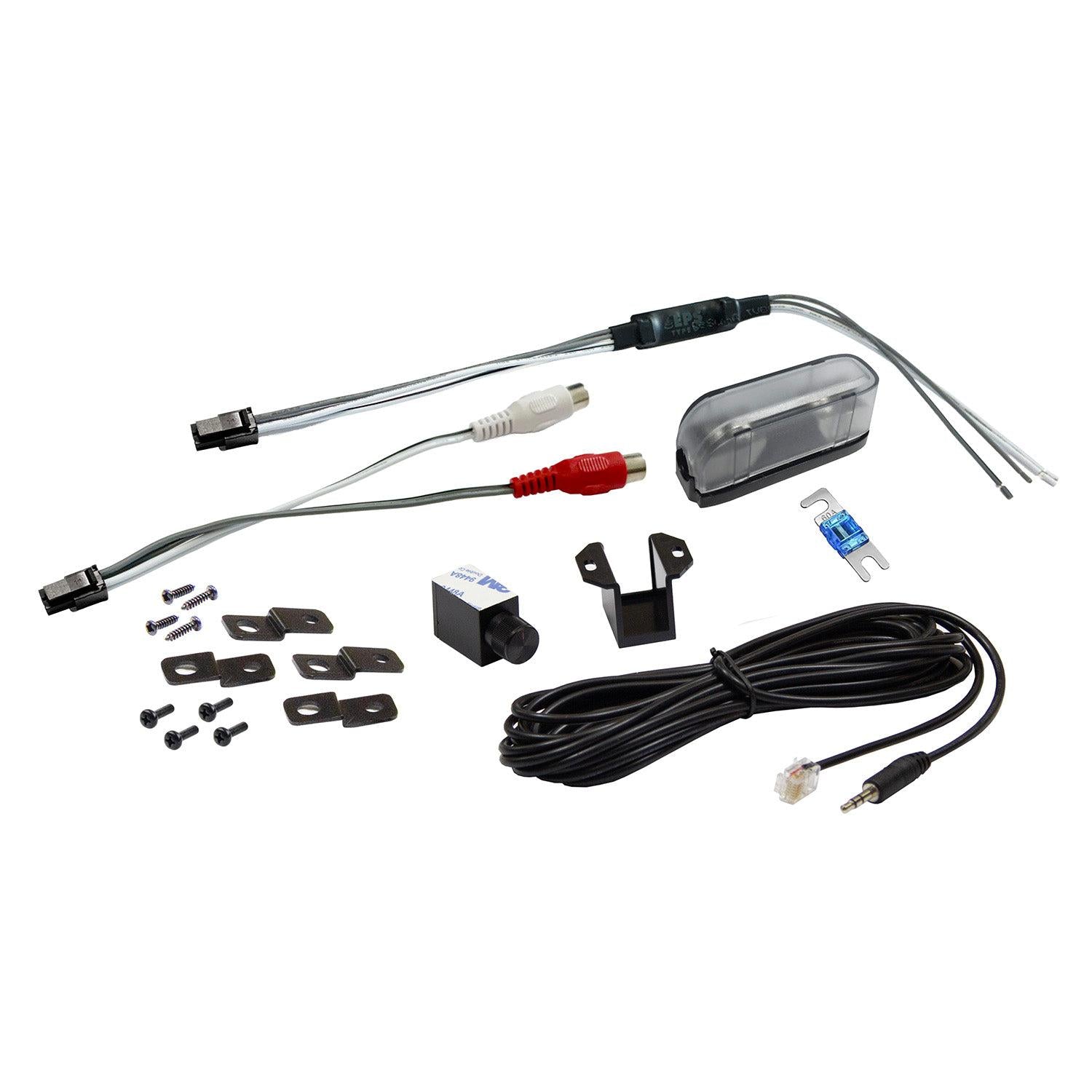 Kit Musway NX600.1: comprende cavi, connettori, accessori di montaggio, una fotocamera compatta e il telecomando Basspegel, il tutto disposto su uno sfondo bianco.