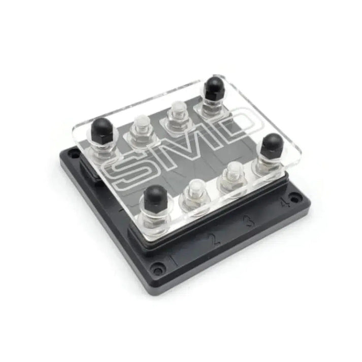 The SMD FB-4 is a black and clear plastic terminal block with four numbered aluminium posts, covered by a transparent lid.