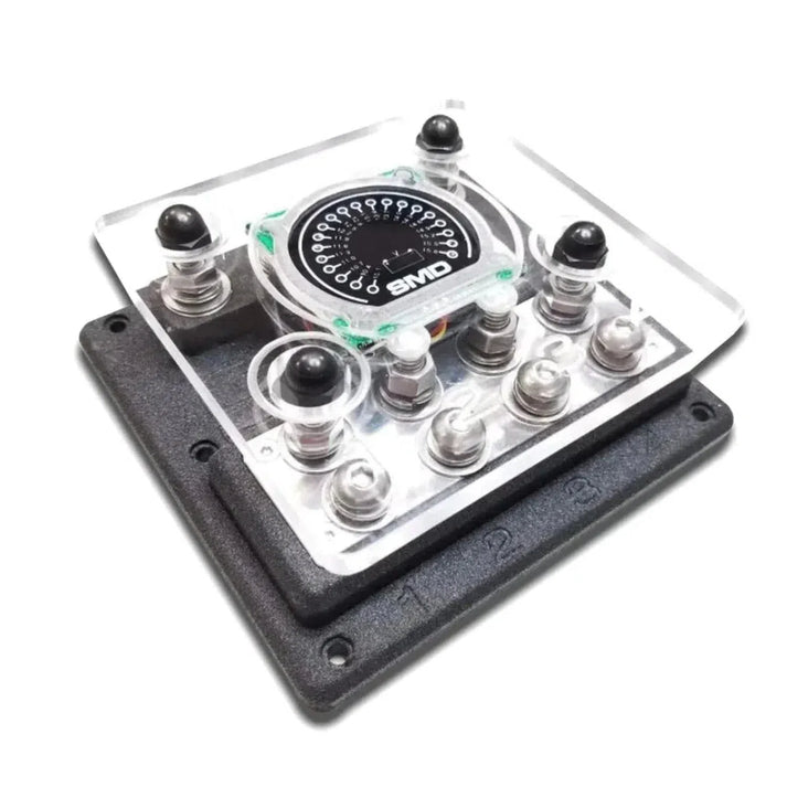 Close-up of an SMD Quad XL ANL Fuse Block VM-1 with black knobs, a dial, and a voltmeter marked 1, 2, and 3 on a black base.