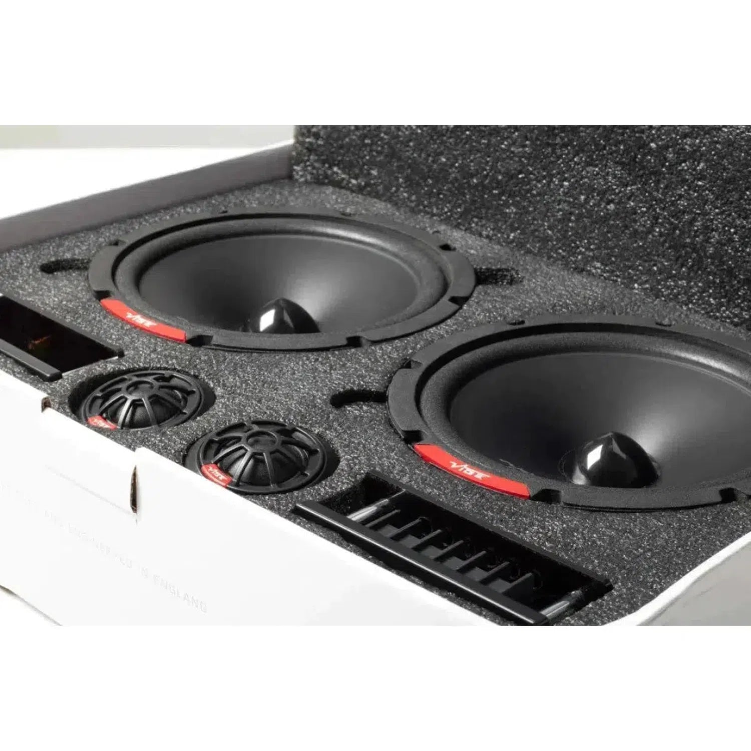 The Vibe Audio Slick 6SQC-V9 speakers, with two cones, two smaller rounds, and a grill, come neatly packed in a foam-lined box for upgraded sound quality.