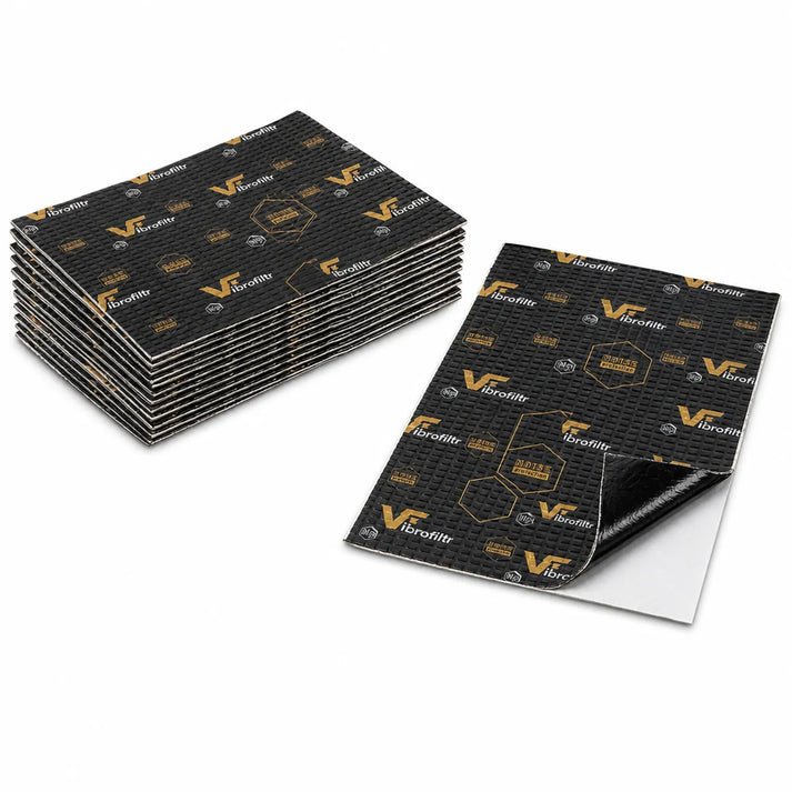 Stacks of Vibrofiltr Pro 2.0 2,0mm 20x35x50cm sheets are shown, with one peeled to display its adhesive backing for soundproofing or vibration dampening.