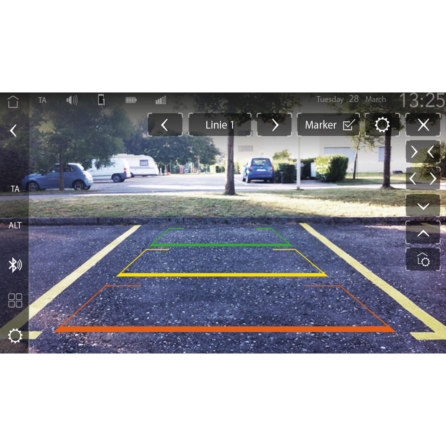 The Zenec Z-N1000 auto radio displays backup camera guides in green, yellow, and orange, with trees and parked cars visible in the background.